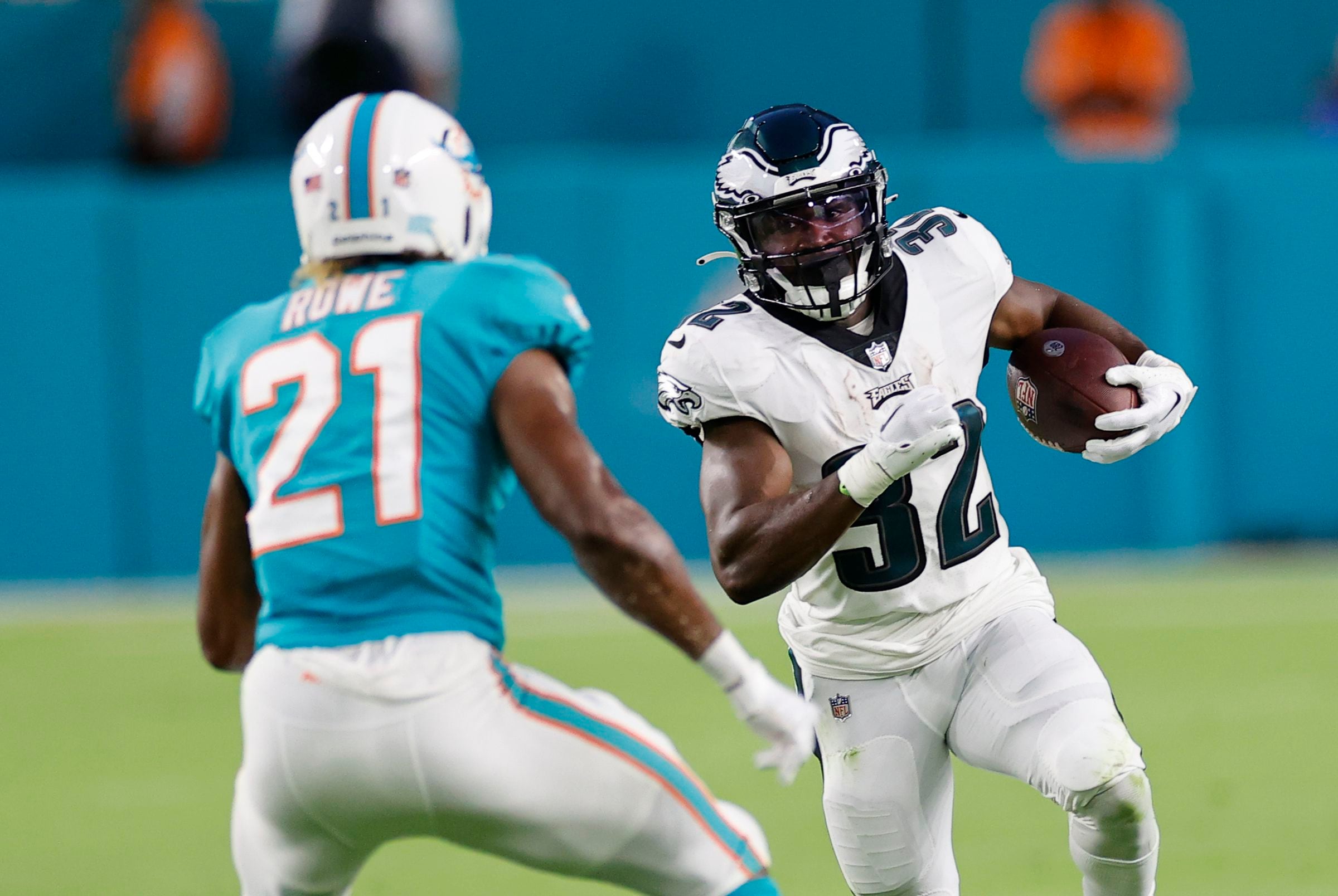 Miami Dolphins quarterback Reid Sinnett (4) looks down the line of