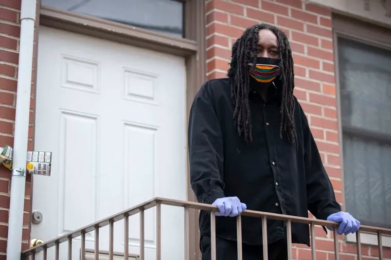 Jondhi Harrell posed for a portrait outside of his home in Philadelphia, Pa. on Thursday, April 16, 2020.  Harrell was hospitalized for nine days with the coronavirus.