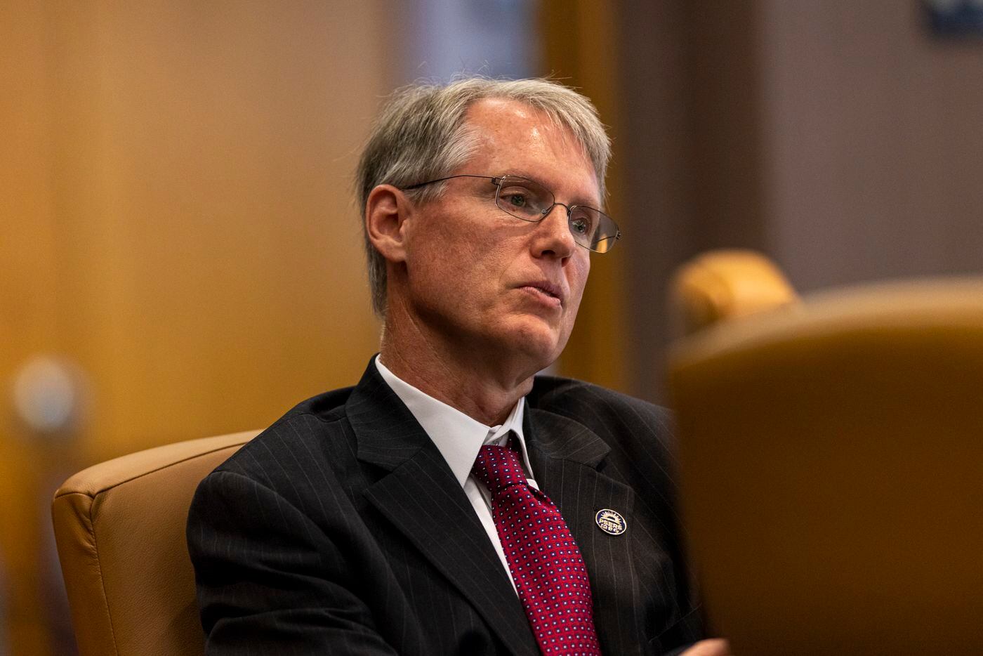 PSERS Investment Head James H. Grossman Jr. listens to a presentation in the boardroom at the PSERS offices on Thursday.