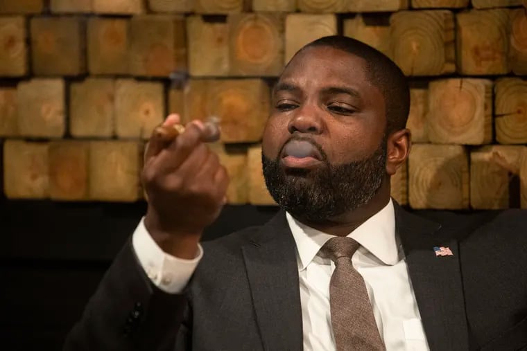 Congressman Byron Donalds smokes a cigar during Congress, Cognac and Cigars at The Cigar Code in Philadelphia on Tuesday, June 4, 2024.