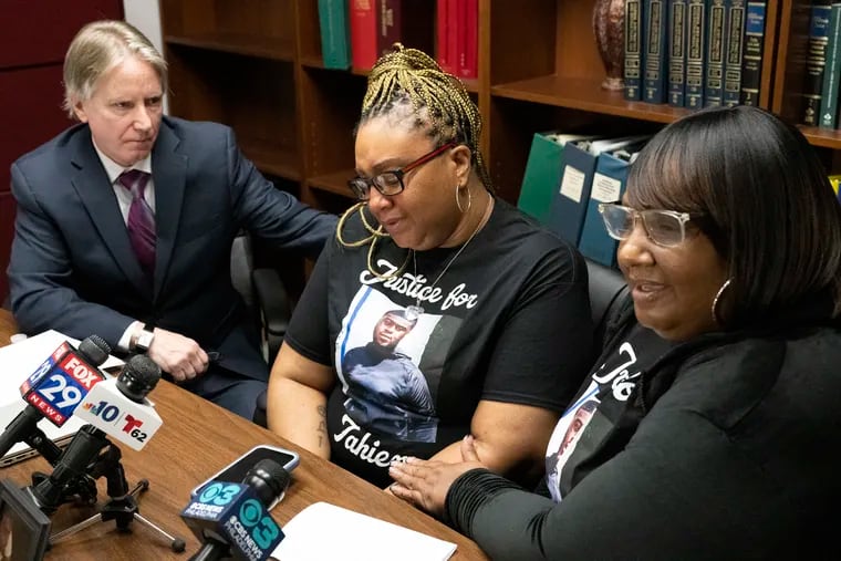 Stacey Weeks, mother of Tahiem Weeks-Cook, speaks to the media during a news conference Tuesday in Philadelphia next to her attorney, Paul J. Hetznecker, and sister, Terra Johnson.