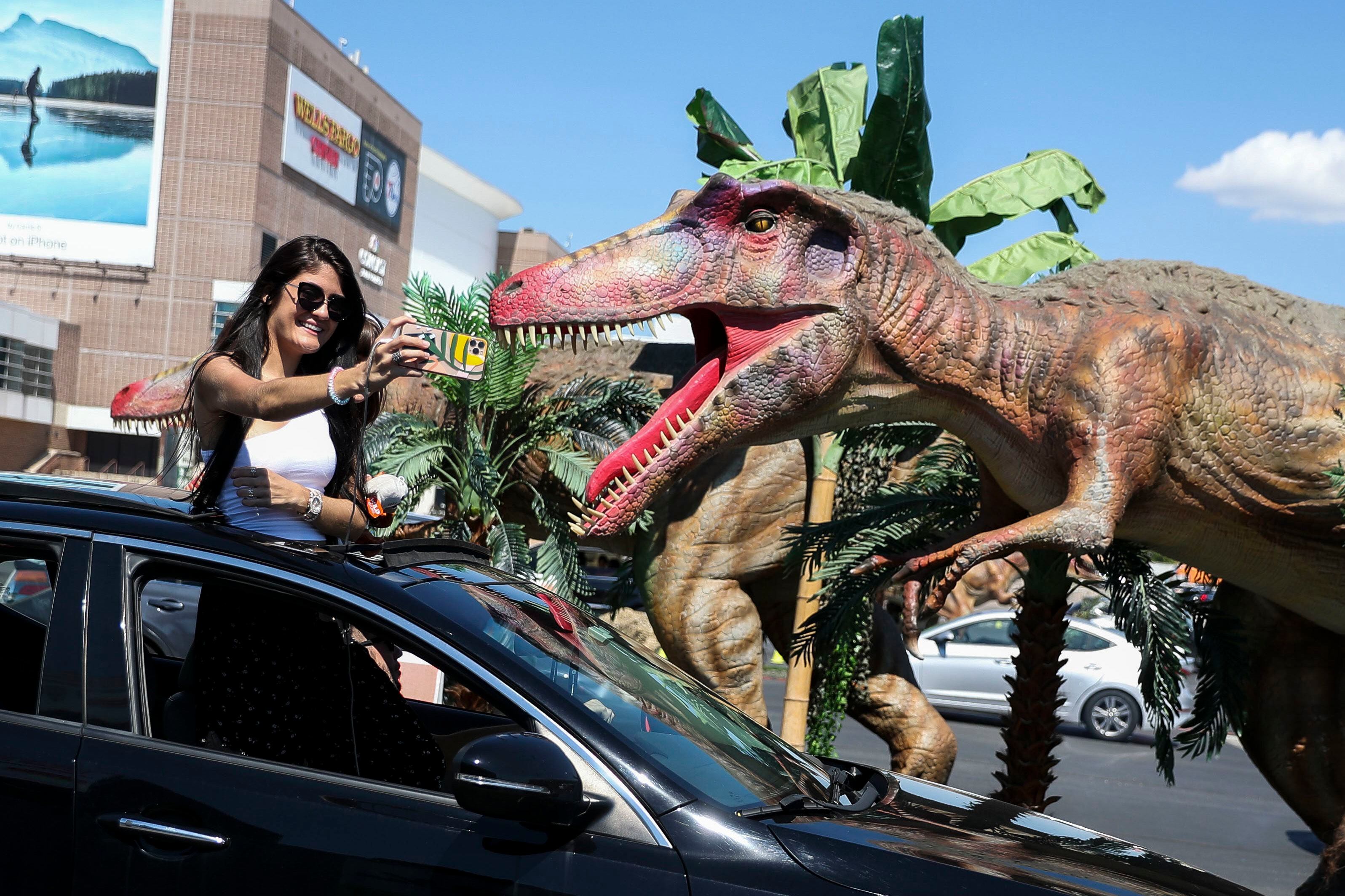 Dinosaurs Invade The Wells Fargo Center Parking Lot And People Stampede To See Them