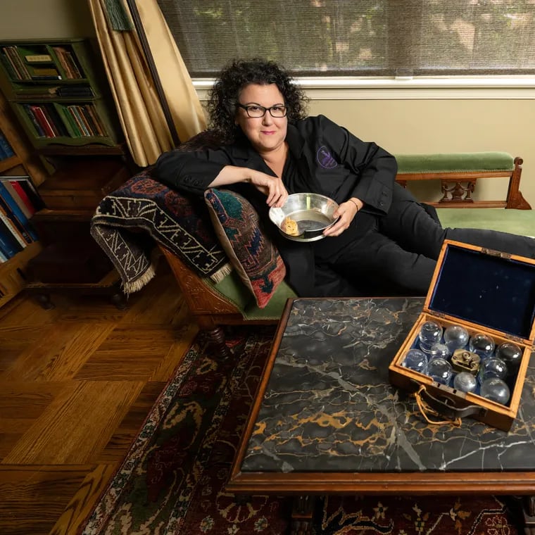 Anna Dhody, the former curator of the Mütter Museum, in Elkins Park, Philadelphia, July 15  2024. She is shown here with antique instruments used for bleeding patients.