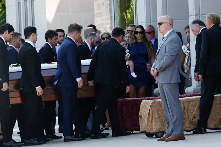 Pallbearers carry the casket of Johnny Gaudreau before a funeral services at St. Mary Magdalen Church in Media on Monday.