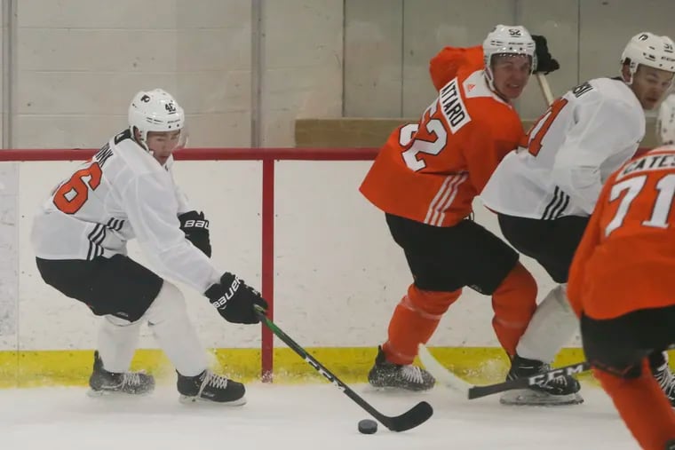 Flyers prospect Bobby Brink (left) comes out with the puck during the team's developmental camp in Voorhees last year.