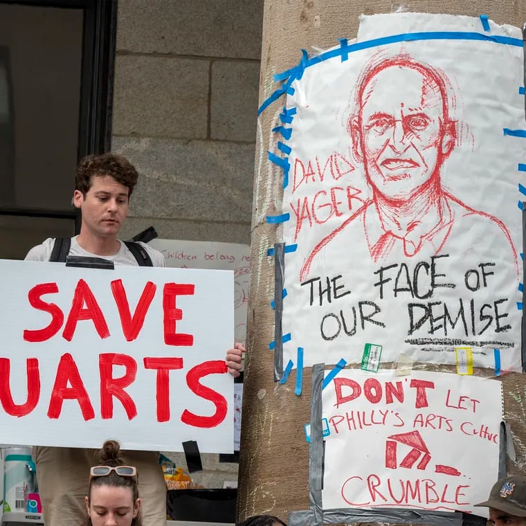 A drawing of David Yager, former president of the University of the Arts, immediately before Kerry Walk - is on a column outside Hamilton Hall on their campus as students, staff, and faculty rally before marching to 1500 Market and another rally in front of the former law offices of UArts chair Jud Aaron.