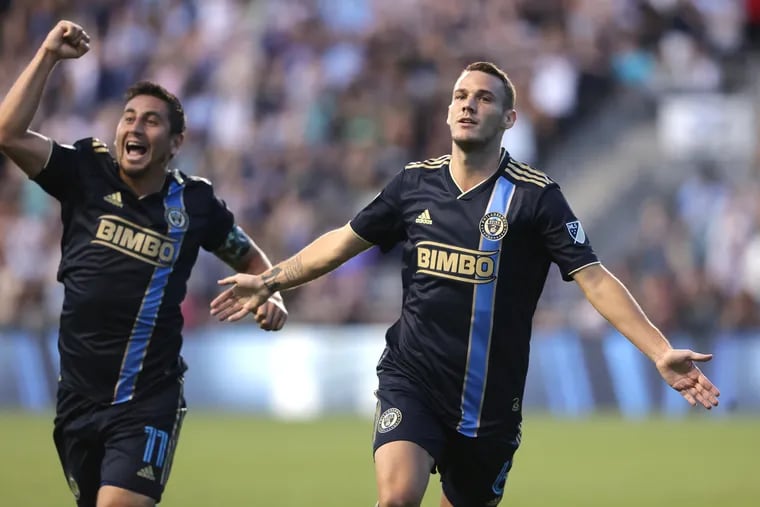 Dániel Gazdag (right) celebrates after scoring a goal against the Chicago Fire at Subaru Park on Aug. 13.
