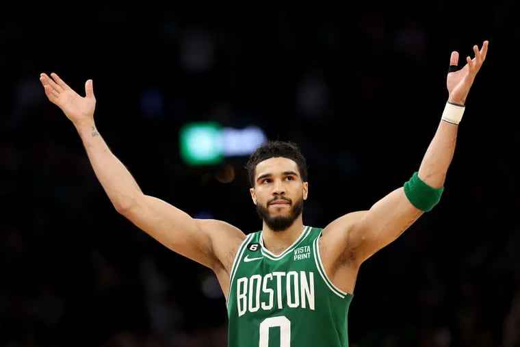 Boston Celtics forward Jayson Tatum celebrates in the waning moments of Sunday’s 112-88 victory over the Philadelphia 76ers in Game 7 of an Eastern Conference playoff series. Boston is now the consensus betting favorite to win its 18th NBA championship. (Photo by Adam Glanzman/Getty Images)
