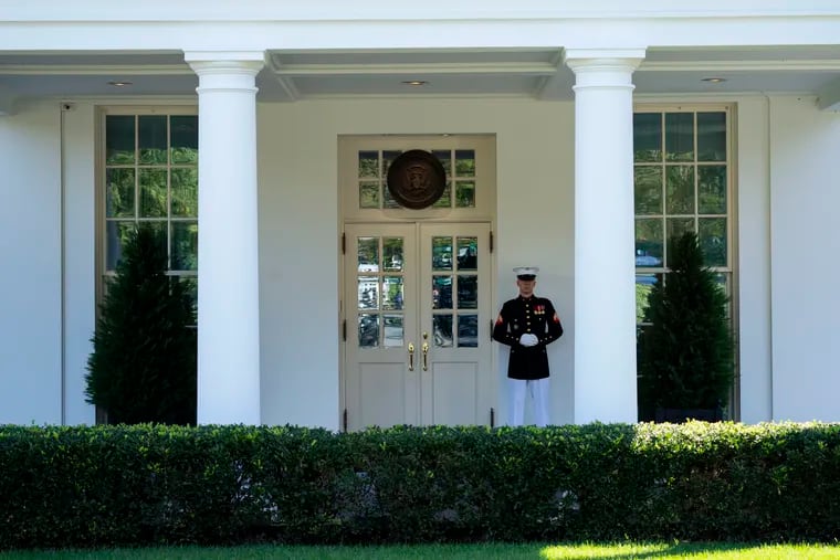 A Marine is posted outside the West Wing of the White House, signifying the President is in the Oval Office, Wednesday, Oct. 7, 2020, in Washington. (AP Photo/Evan Vucci)