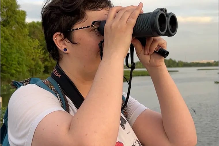 Elise Greenberg, one of the founding members of Philly Queer Birding, bird watching at John Heinz Refuge in May 2024.