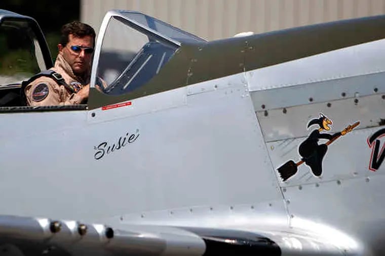 Above: Jim Beasley Jr., leader of an aerobatic team of World War II-era fighter planes called the Horsemen, prepares for flight. Below: Ed Shipley, the group's founder, in an AT-6 Texan. The Horsemen will take part in the Atlantic City air show Wednesday.