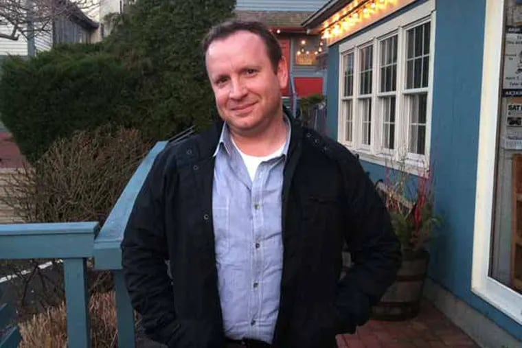 Portrait of Eric Miller in Newtown, PA outside restaurant after interview.  (Photo by Mike Vitez)