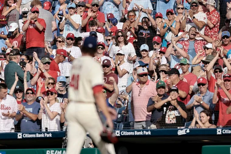 Fans cheer for Phillies pitcher Tyler Phillips as he comes out of the game against the Oakland Athletics on Saturday.