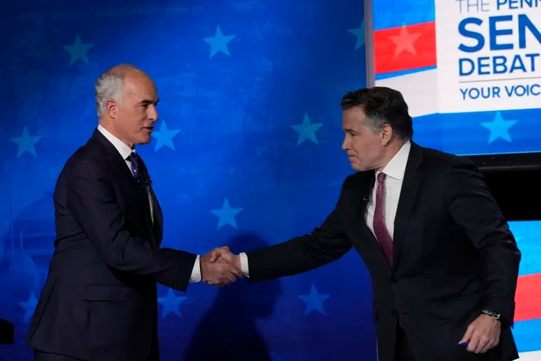 Pennsylvania Senate candidates Sen. Bob Casey (left) and David McCormick shake hands after a 6abc debate last week.