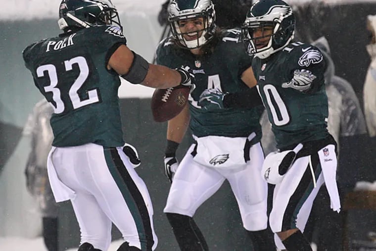 Chris Pol (left) celebrates his touchdown against the Lions with Riley Cooper (center) and DeSean Jackson (right). (Yong Kim/Staff Photographer)