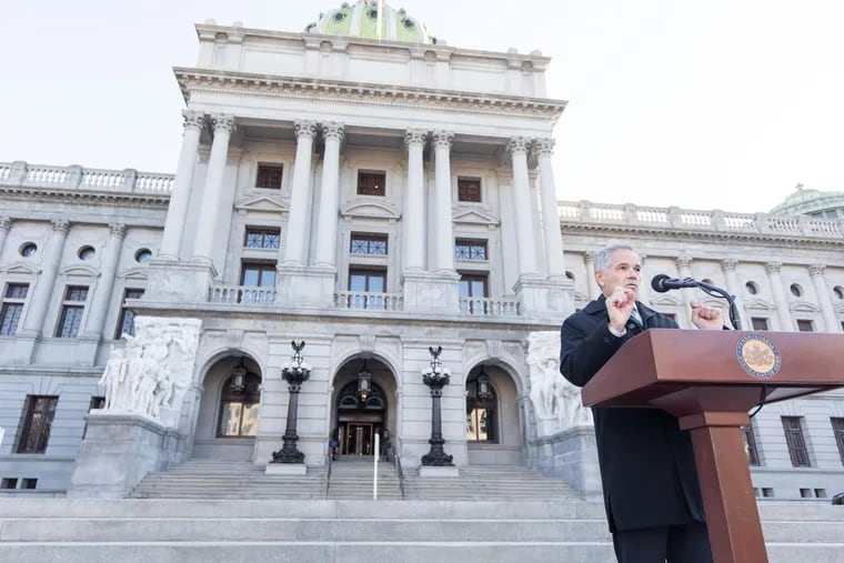 Philadelphia District Attorney Larry Krasner speaks at a news conference on the steps of the Capitol in Harrisburg on Friday.