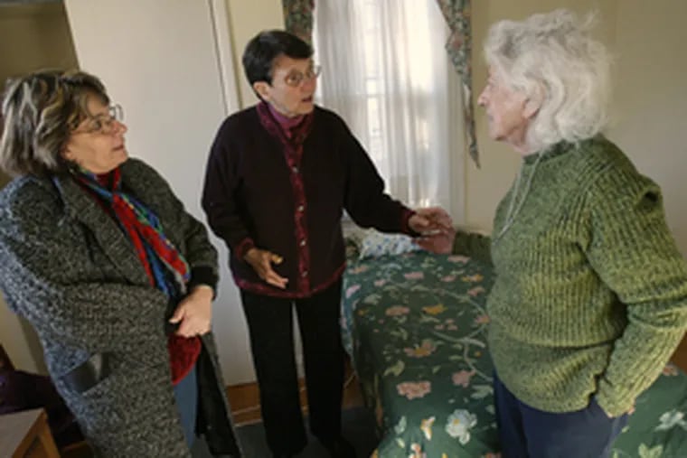 In a bedroom at Dawn&#0039;s Place, a soon-to-be-open shelter for prostitutes looking to get out of the life, are board members (from left) Donna Sabella, a mental-health nurse, Sister Terry Shields and Sister Teresita Hinnegan.
