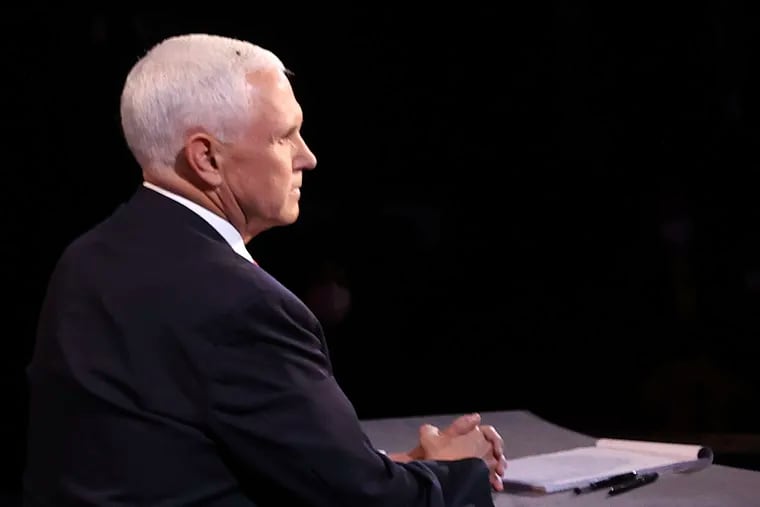 A fly lands on the head of Vice President Mike Pence during the vice presidential debate.