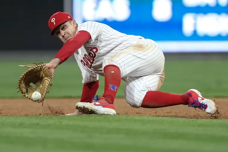 The Athletic MLB on X: Phillies first baseman Rhys Hoskins was carted off  the field after suffering an apparent left knee injury during  Philadelphia's game against Detroit on Thursday.    /