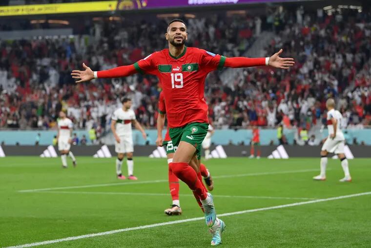 Youssef En-Nesyri of Morocco celebrates after scoring the team's first goal during the FIFA World Cup Qatar 2022 quarter final match between Morocco and Portugal at Al Thumama Stadium on December 10, 2022 in Doha, Qatar. (Photo by Justin Setterfield/Getty Images)