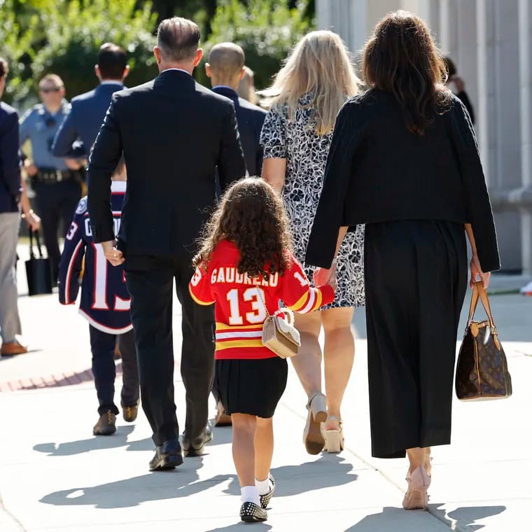 A young attendee wears a Johnny Gaudreau jersey as they arrive for funeral services for Johnny and Matthew Gaudreau at St. Mary Magdalen Church in Media.