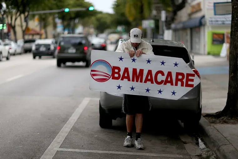 A Miami insurance company advertises to can sign people up for the Affordable Care Act, also known as Obamacare, in 2015.