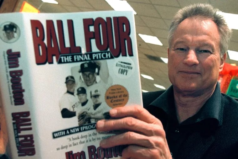 Jim Bouton signing a copy of "Ball Four" in 2000.