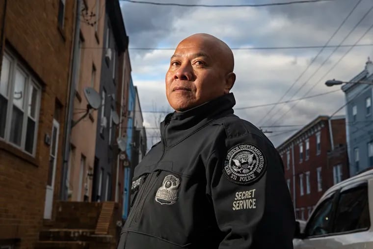 Leth Oun, a Cambodian immigrant who survived the Khmer Rouge Killing Fields as a boy, came to the U.S. and ended up in the Secret Service, protecting presidents. An important part of his story is the eight years he spent in Philly as a young adult, getting degrees at CCP and Widener and then starting to work in probation and corrections for the federal government. He has written a book about his life. Poceeds will go to help other Cambodians. He is shown in his old neighborhood near Sixth and Dickinson streets on Jan. 26, 2023.