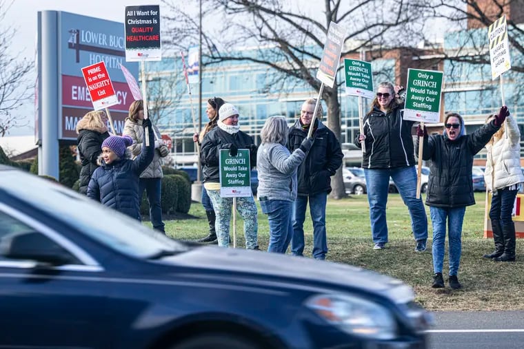 Nurses at Lower Bucks Hospital and Suburban Community Hospital protest on Friday, Dec. 22, 2023, during a strike rally outside the Lower Bucks Hospital in Bristol, Pa.