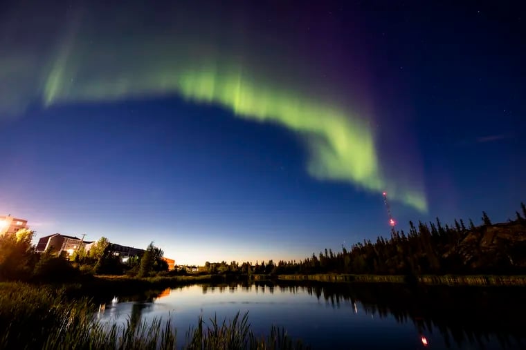 The northern lights, or the aurora borealis, appear in the sky over Rat Lake in Yellowknife in Canada's Northwest Territories last month. The solar storms that ignite the aurora were especially plentiful in August.