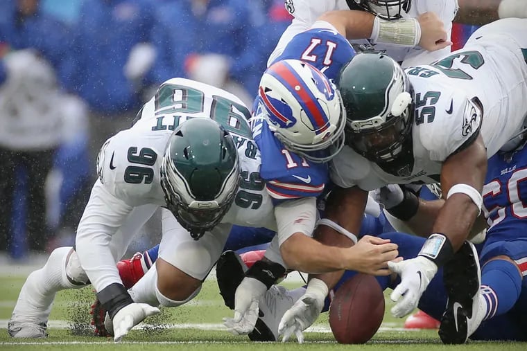 Eagles defensive end Brandon Graham (55) forced this second-quarter fumble by Bills quarterback Josh Allen (17), and then managed to recover it, setting up a momentum-shifting scoring drive.