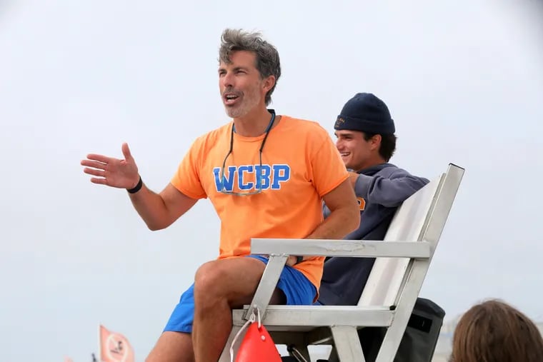 Drexel business professor Robert Morier, of Philadelphia, on his lifeguard stand with his stand partner, John Feraco, on the beach in Wildwood Crest on Saturday, his last weekend stint of the summer. Morier has been moonlighting as a Wildwood Crest lifeguard all summer and "exploring how lifeguarding fosters innovation and leadership.