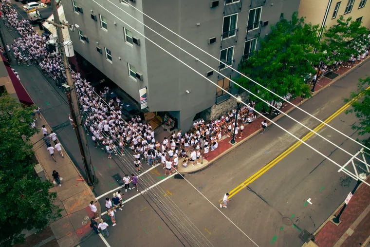 A line for Doggie's Pub in State College stretches down Pugh Street and into Calder Way. LineLeap, a $100 million start-up that has partnered with almost every downtown bar in the college town, allows users to skip lines like these at a price ranging from $10 to $100 or more, depending on demand.