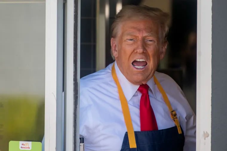 Former President Donald Trump talks with reporters after working the drive-thru window at a McDonald’s Sunday, Oct. 20, 2024, in Feasterville, Pennsylvania.