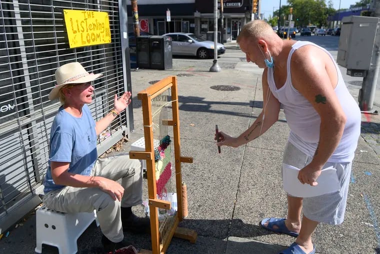 Jimmy Flanagan, currently of Germantown and originally of Kensington, took a minute to chat with Artist Kathryn Pannepacker while also talking on FaceTime with a friend at the corners of Germantown and Chelten Avenues.