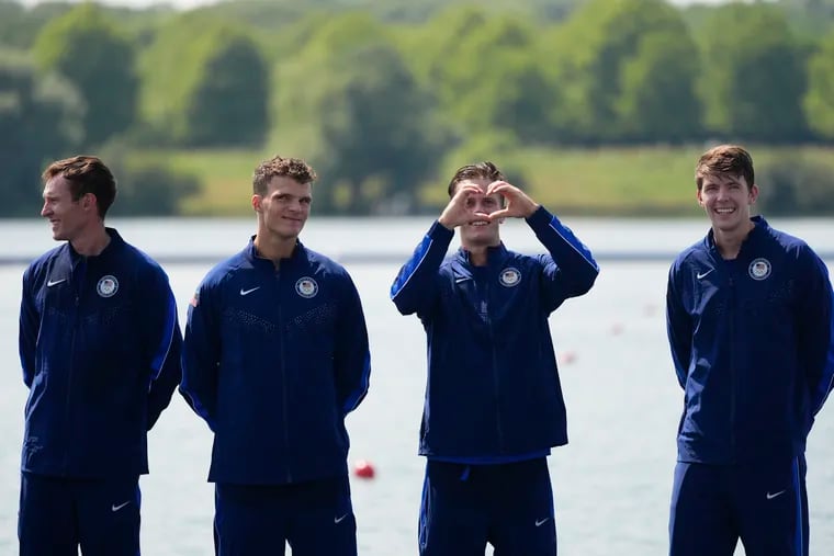 United States' Justin Best, second from right, celebrates with teammates (from left) Liam Corrigan, Michael Grady, and Nick Mead after winning gold at the Paris Olympics.