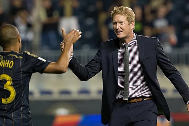 Philadelphia Union head coach Jim Curtin (R) and defender Fabinho (33) celebrate their victory against the Chicago Fire in the U.S. Open Cup Semifinal match at PPL Park. The Union won 1-0. (Bill Streicher/USA Today)