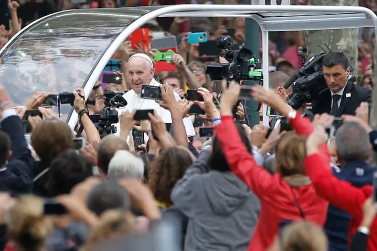 MICHAEL BRYANT / STAFF PHOTOGRAPHER Many with &quot;golden tickets&quot; to see the pope yesterday were forced to watch on Jumbotrons.