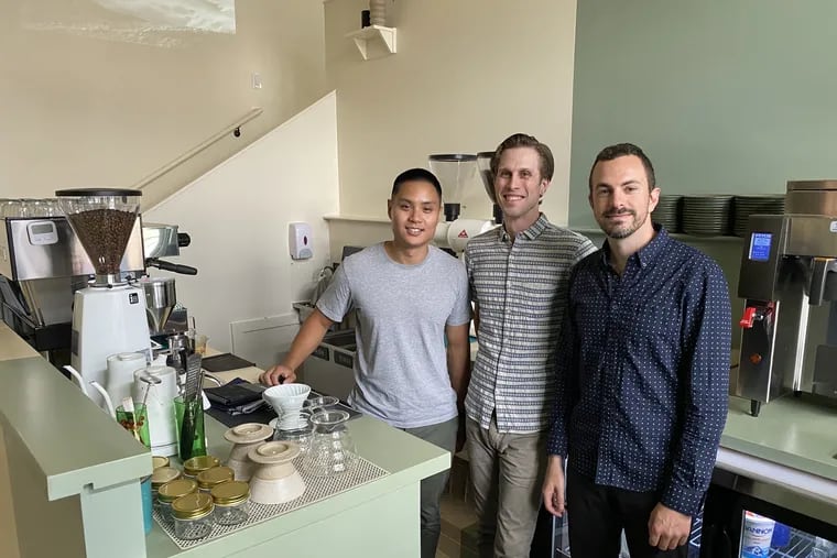 Forin Cafe owners (from left) Will Landicho, Kyle Horne, and Seth Kligerman at the espresso machine. The cafe is part of a redevelopment of the old Harbisons dairy plant in Kensington.