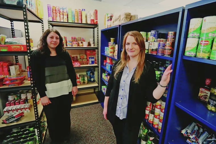 Jodi Roth-Saks (left) and Tori Nuccio launched and supported a food pantry at West Chester University in 2017. A bill introduced in 2020 would give colleges more aid to directly help hungry students in Pennsylvania.