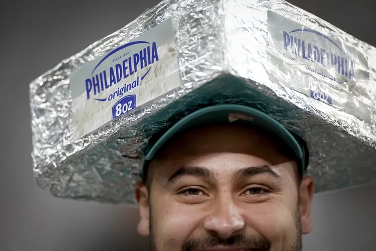 Lucas Paiva wears a homemade cream cheesehead at the Eagles season opener against the Green Bay Packers at Corinthians Arena in São Paulo, Brazil.