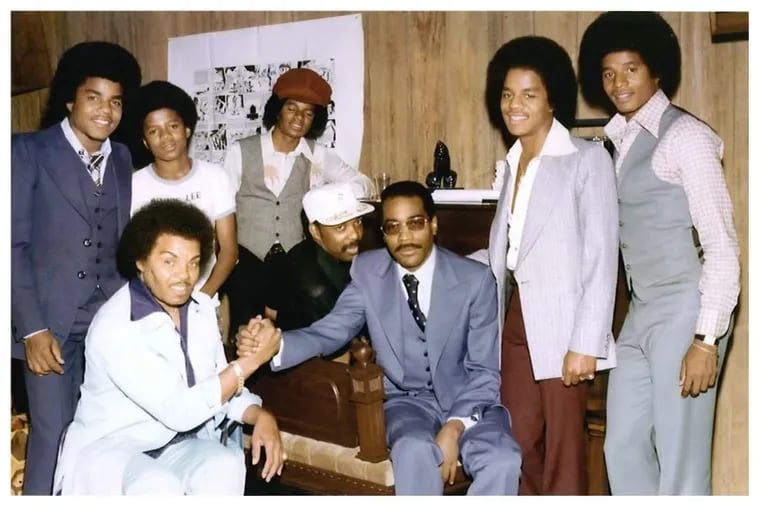 Tito Jackson (far left) and the Jacksons with Kenny Gamble and Leon Huff (center).