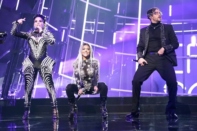 Ivy Queen, left, seen here performing with Nesi and Bad Bunny during the 2020 Billboard Music Awards on Oct. 14, 2020, at the Dolby Theatre in Hollywood, California, hosts a hit Spotify podcast on the history of reggaeton.