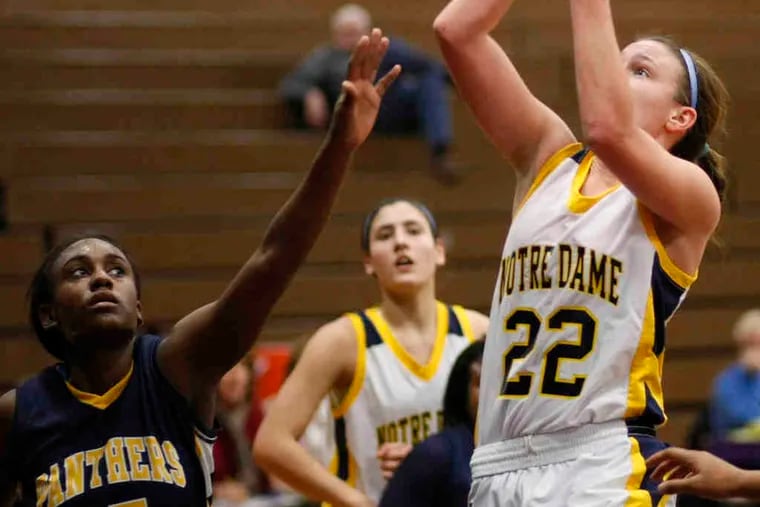 Notre Dame's Megan McGurk shoots over the outstretched Christina Coleman of Cheltenham. McGurk scored 21 points.
