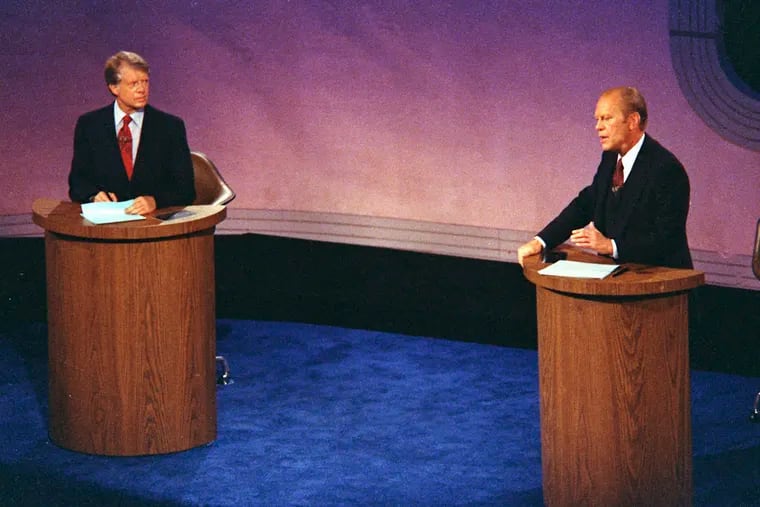 President Gerald Ford (right) speaks as Jimmy Carter listens during the first of three televised debates on Sept. 23, 1976, in Philadelphia. Presidential debates didn't become a recurring event until 1976 when the League of Women Voters began sponsoring them.