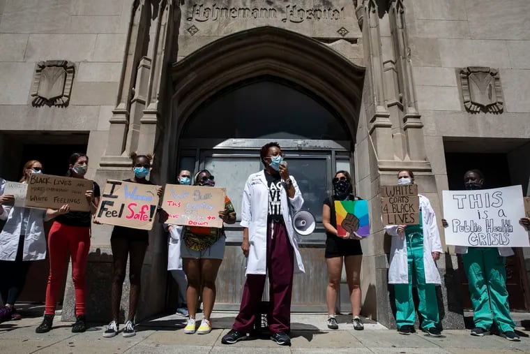 Sarita Metzger speaks outside of the shuttered Hahnemann University Hospital in Philadelphia, Pa. on Sunday, June 7, 2020. The group of over 70 doctors, medical workers and protesters marched from Hahnemann to City Hall.