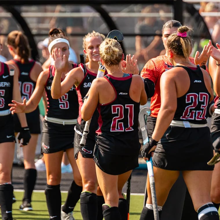 The St. Joe's field hockey team celebrates after a game earlier this season.