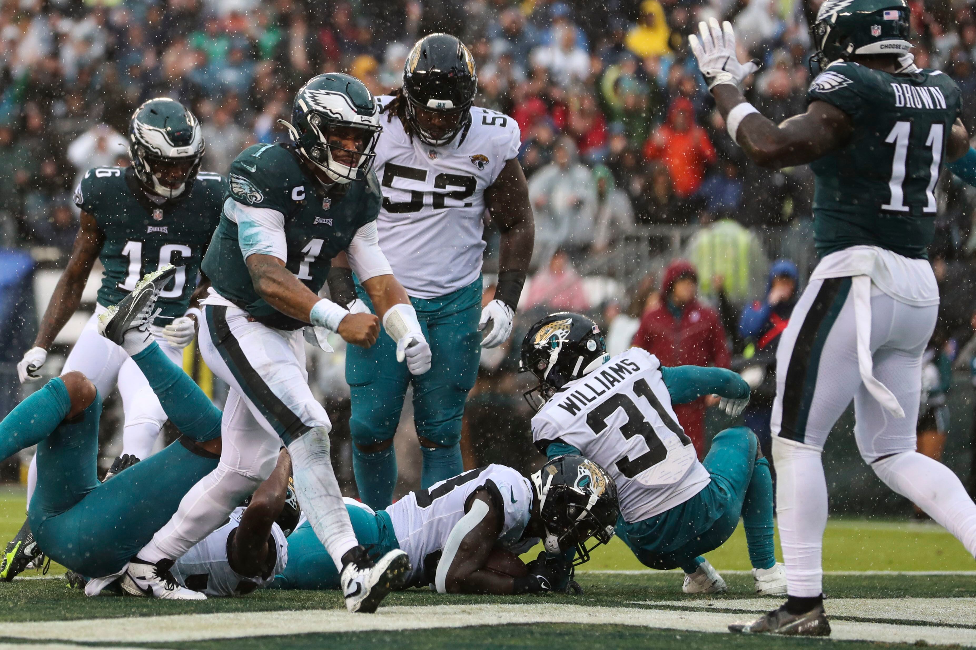 Eagles' Jalen Hurts powers his way into the end zone to cut the Jaguars'  lead