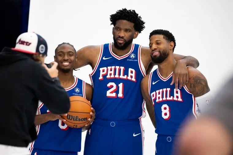 Philadelphia 76ers guard Tyrese Maxey, center Joel Embiid and forward Paul George pose for photos during Sixers Media Day at the Sixers Practice Facility in Camden, NJ on Monday, Sept. 30, 2024.