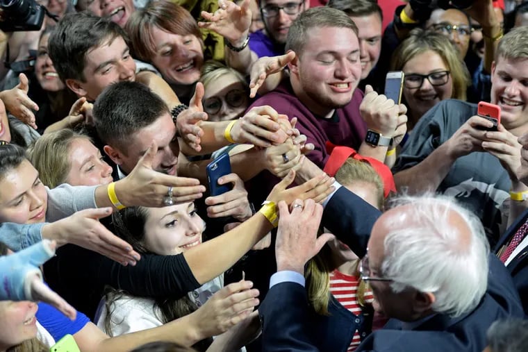 Democratic presidential hopeful Bernie Sanders works the crowd after speaking at Temple University's Liacouras Center on April 6, 2016.